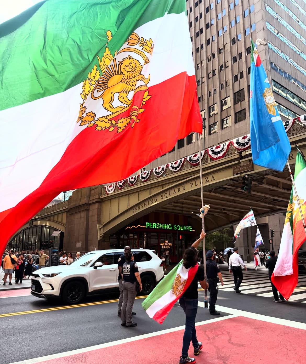 Iranian flag waved at a rally