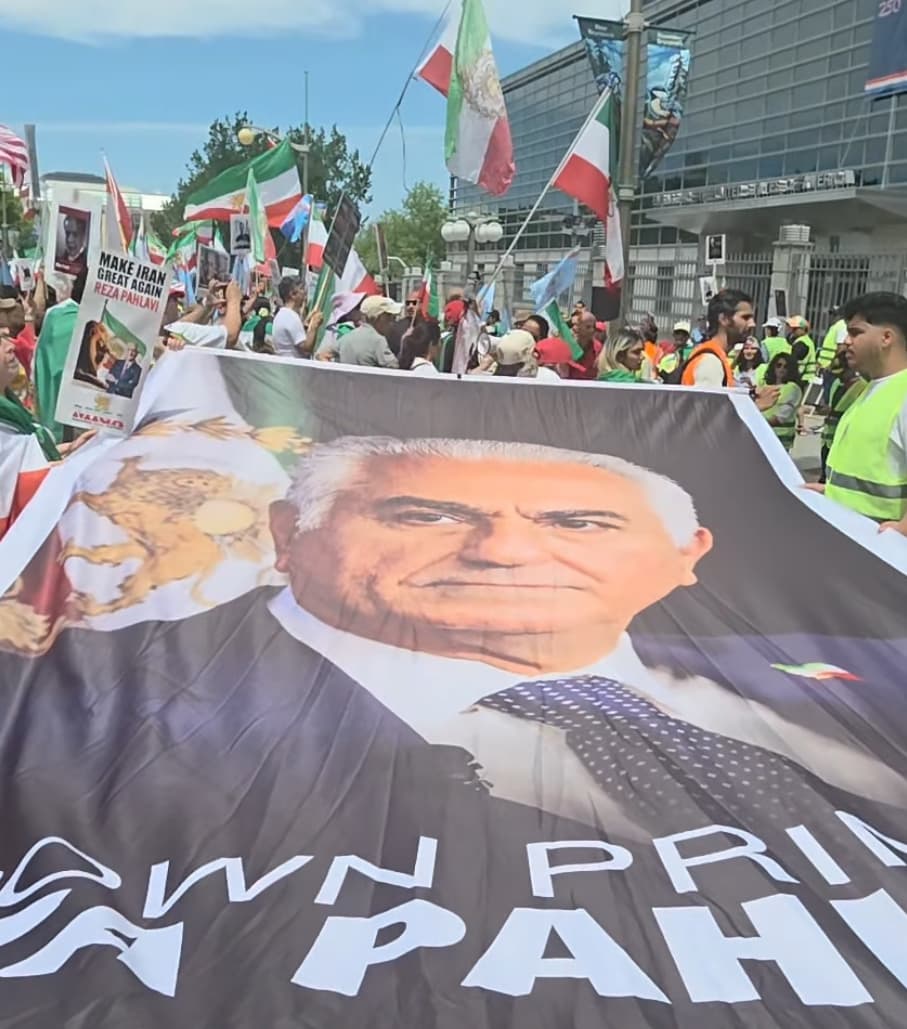 Banner depicting Prince Reza Pahlavi carried at a rally